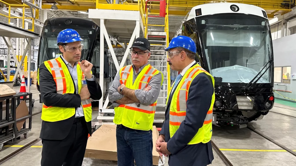 MPP Sheref Sabawy speaks with industry professionals at a manufacturing facility for railed transit cars.